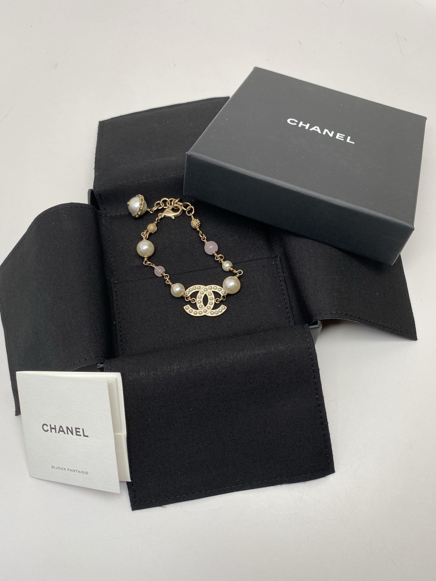 CHANEL GOLD TONE CC BRACELET WITH PEARLS