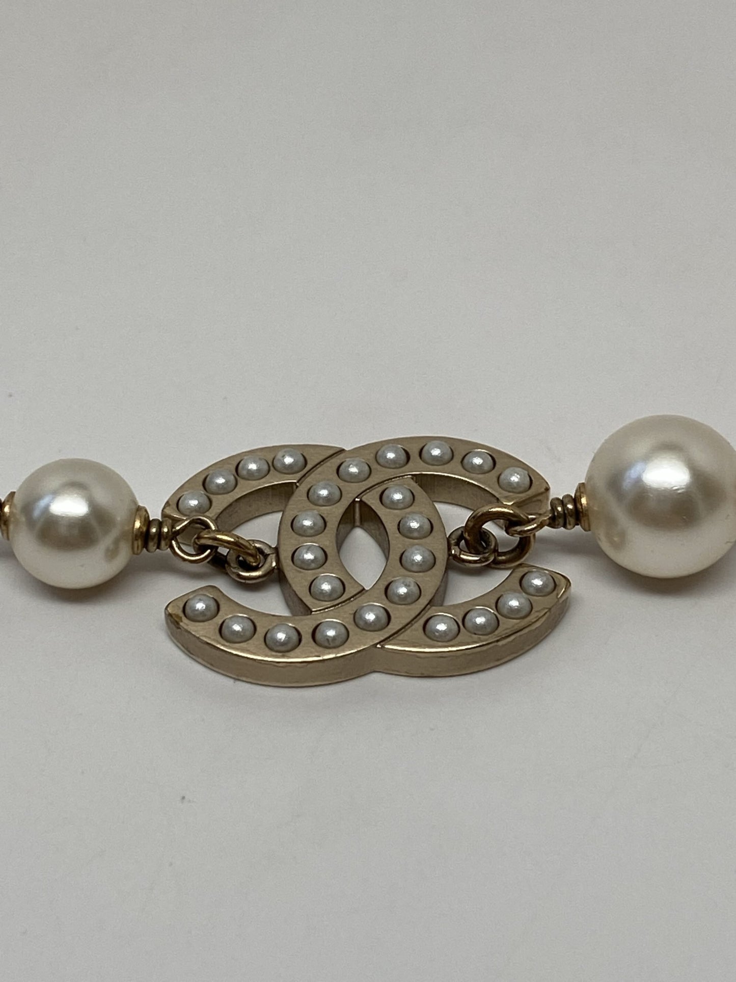 CHANEL GOLD TONE CC BRACELET WITH PEARLS