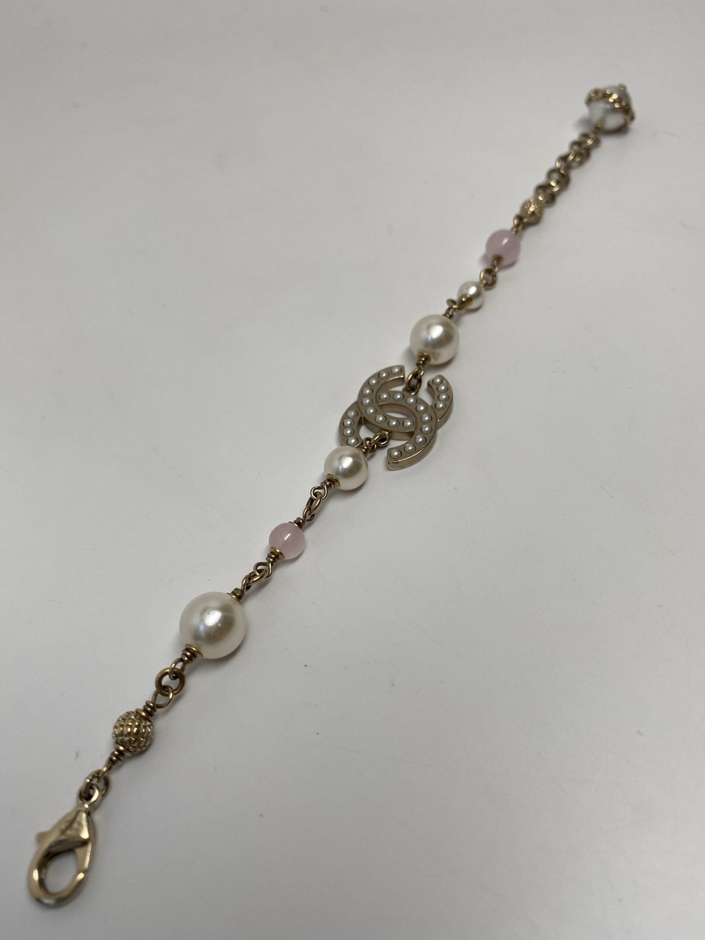 CHANEL GOLD TONE CC BRACELET WITH PEARLS